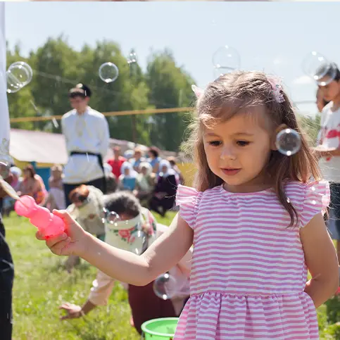 Girl playing with bubbles at a family event in the Four Corners